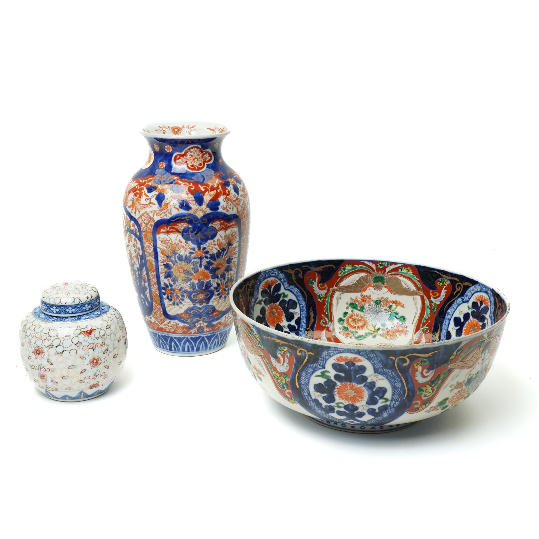 Late 19th/Early 20th century Japanese Imari bowl decorated with panels of flowers in blue, orange and green etc D27cm, Imari vase H24cm and a small ginger jar (3)