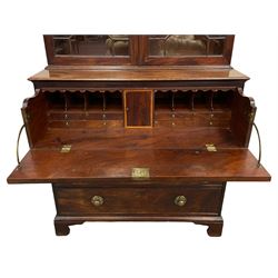 Regency mahogany secretaire bookcase, scrolled swan neck pediment over two astragal glazed doors, fitted with four adjustable shelves, the lower section with fall front secretaire drawer enclosing pigeon holes, small drawers and cupboard with painted numbers, three long graduating drawers below, on bracket feet