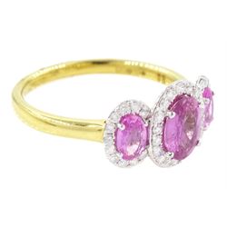 18ct gold pink sapphire and diamond trilogy ring, three oval cut sapphires surrounded by round brilliant cut diamonds, hallmarked, total sapphire weight approx 1.45 carat, total diamond weight approx 0.25 carat
