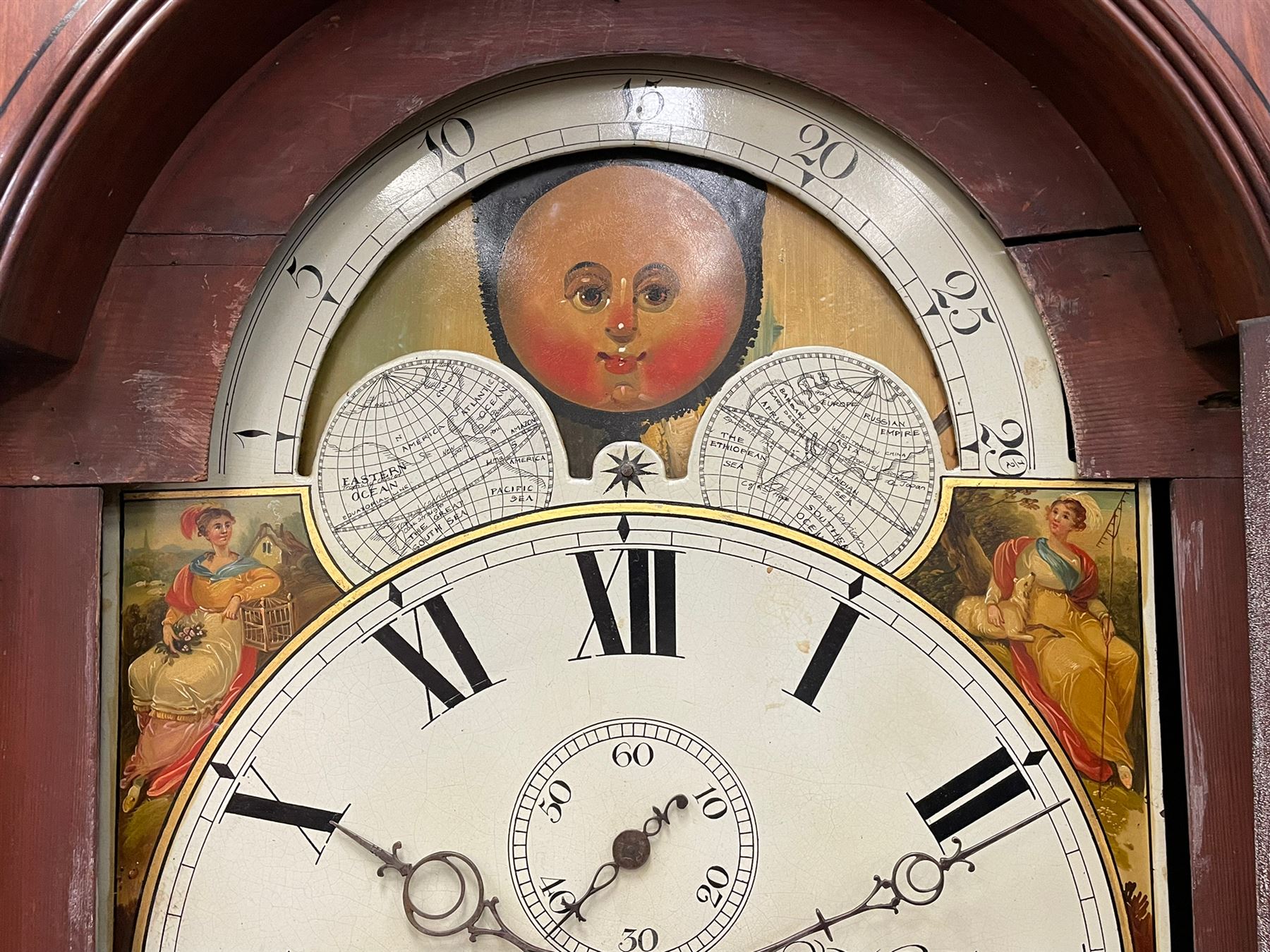 Nathaniel Dumville of Stockport - 8-day brass inlaid mahogany longcase clock c1840, swans neck pediment with ball and spire finials and wooden paterae, recessed break arch hood door flanked by rope twist pilasters, trunk with conforming pilasters and gothic ogee topped door, canted plinth raised on bracket feet, fully painted break arch dial with moon work and spandrels depicting the four seasons, centre with Roman numerals, minute track, subsidiary date and seconds dials, matching stamped brass hands, four pillar movement with an anchor escapement, rack striking on a bell. With weights and pendulum.
The Dumville family were prevalent Cheshire clockmakers working in Stockport 1820-42.
