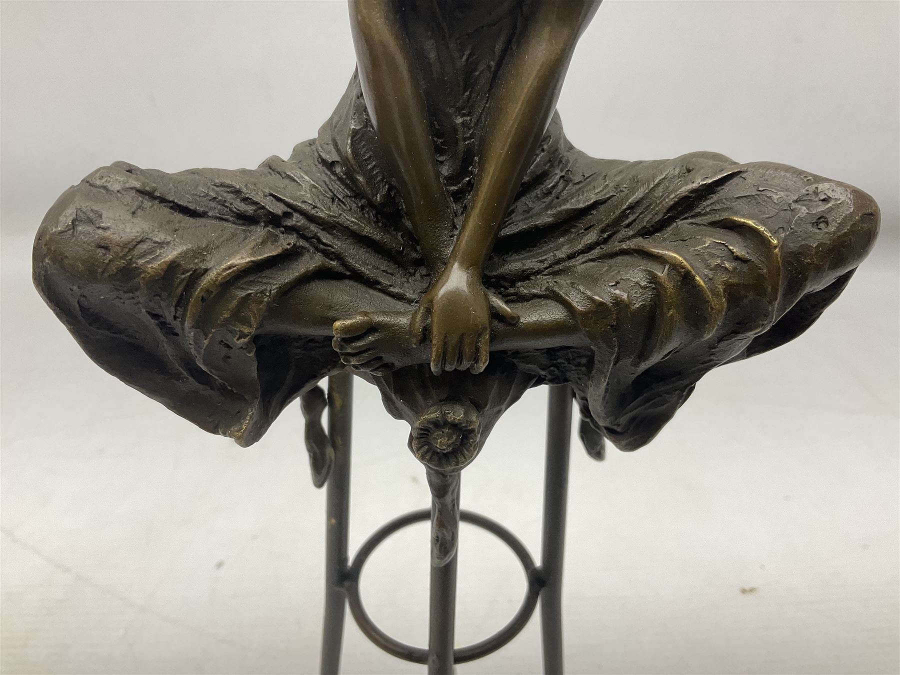 Art Deco style bronze modelled as a female figure seating crossed legged upon a chair, after Pierre Collinet, H28cm