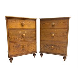 Pair early 20th century pitch pine chests, fitted with three graduating drawers, on turned feet
