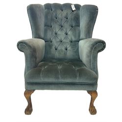 Georgian design wingback armchair, traditional shape with rolled arms, upholstered in teal velvet fabric, on cabriole supports with ball and claw feet