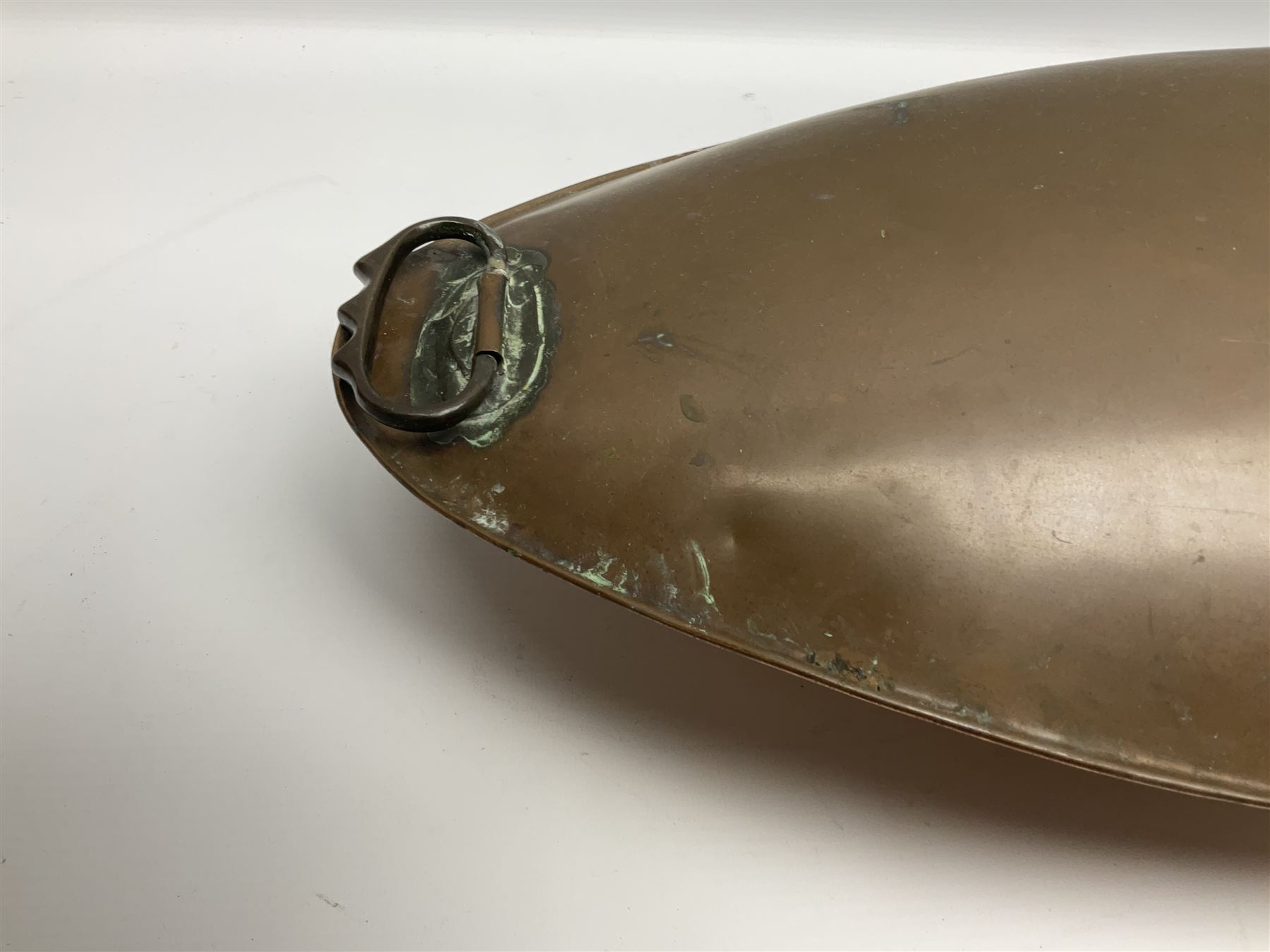 Victorian copper carriage foot warmer of flattened oval form with two carrying handles, L70cm