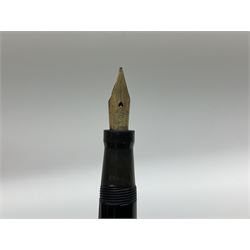 Vintage Swan Mabie Todd lever fill fountain pen in coral red, the nib a/f marked 14K, together with two further vintage Swan Mabie Todd fountain pens, the first example with lever fill, the other leverless, each with black body, one with nib marked 14ct, (3) 