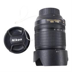 Nikon D7100 DSLR camera body, serial no. 2522259, with an AF-S Nikkor 18-105mm 1:23.5-5.6G ED lens, boxed with strap