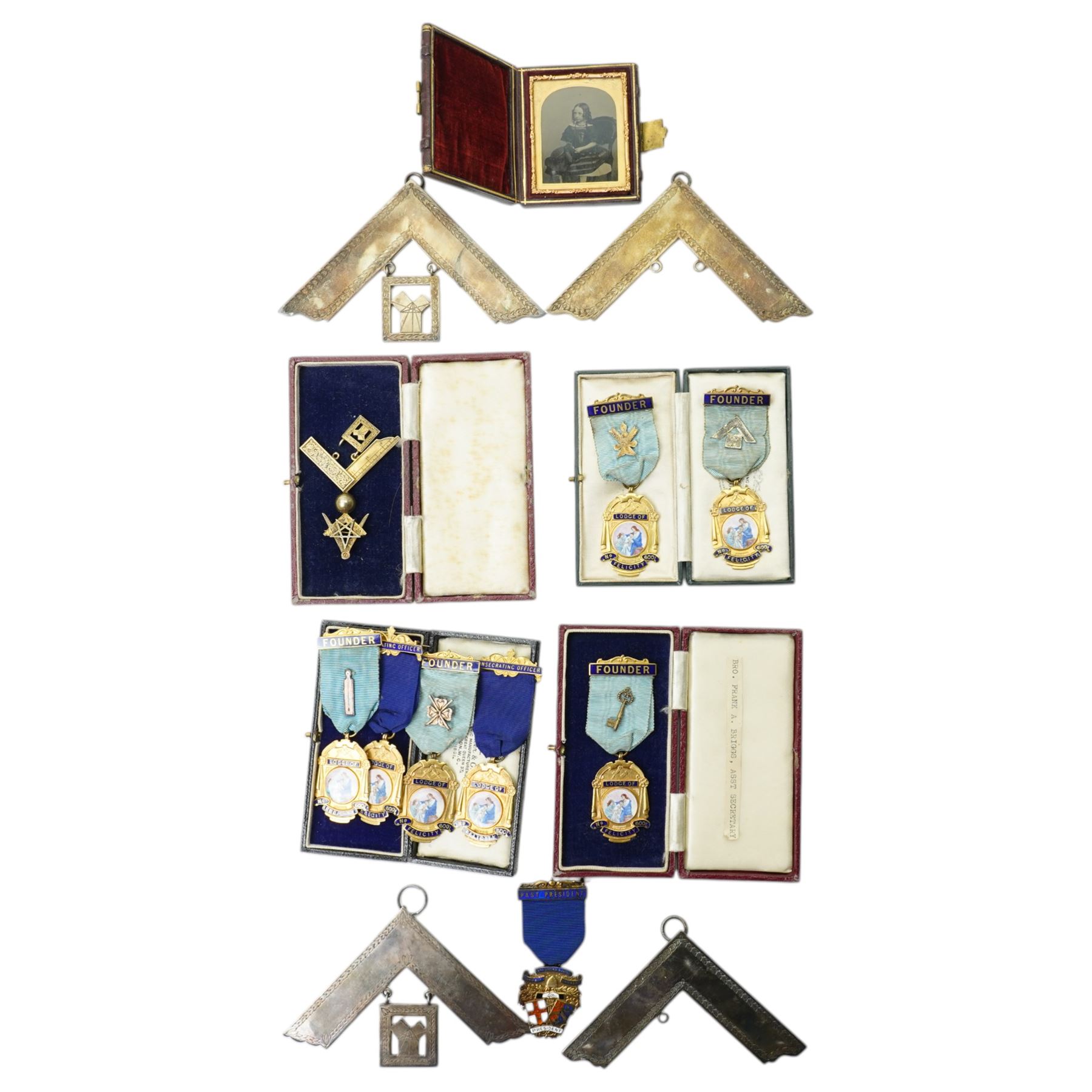 Masonic Jewels comprising seven enamel and gilt 'Lodge of Felicity', five dated 1945, four silver-plated examples collar jewels, a silver-gilt jewel, together with a cased Victorian photograph and a silver-gilt medal for 'Past President Chamber of Trade, Bradford & District', including some cases 
