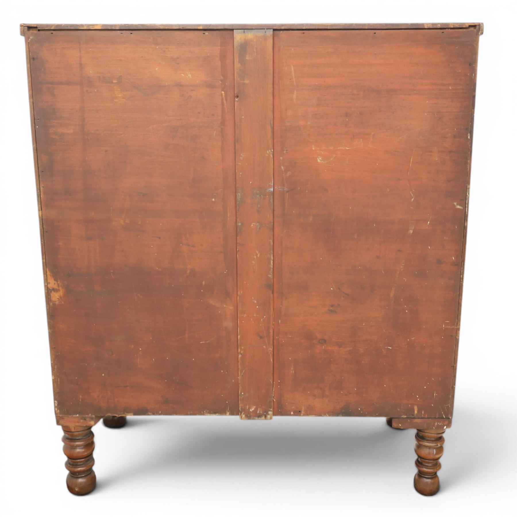 Victorian mahogany bow fronted chest, fitted with two short and three long drawers, flame mahogany front, bone escutcheons and turned wooden handles, quarter barley twist columns, raised on turned supports