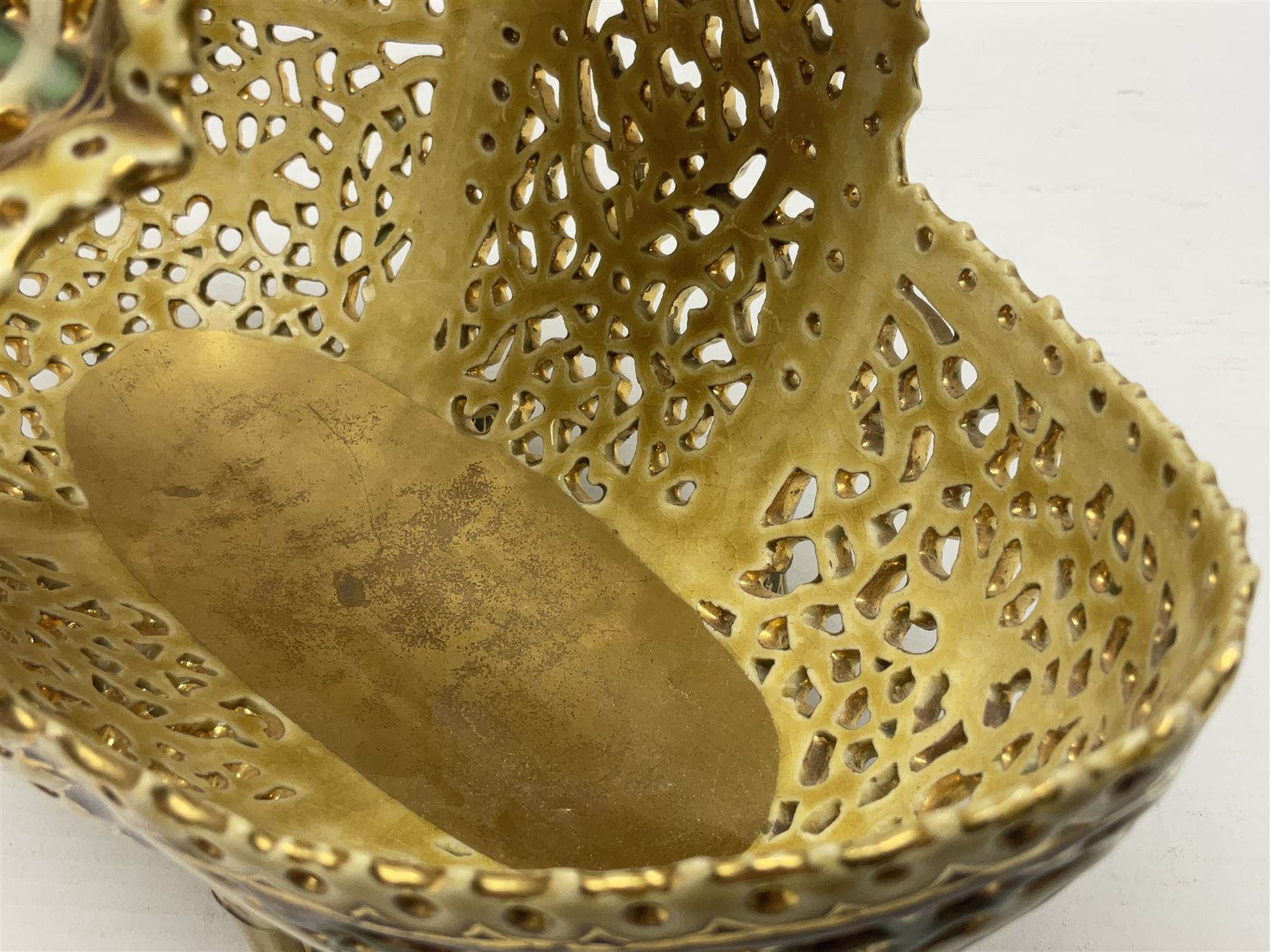 Hungarian Zsolnay Pecs gilt and green reticulated basket, upon four feet, with gold mark beneath, H14cm L21cm