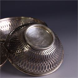 Three 1930s silver bon bon dishes, comprising pair and one larger example, each of circular form with pierced latticework sides, hallmarked Maxfield & Sons Ltd, Sheffield 1936, largest D12cm