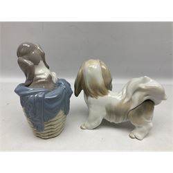 Five Lladro figures, comprising Lhaso Apso no 4642, Dog in Basket no 1128, Beagle Puppy no 1128, Attentive Bear no 1204 and Rabbit Eating no 4773, largest example H19cm 