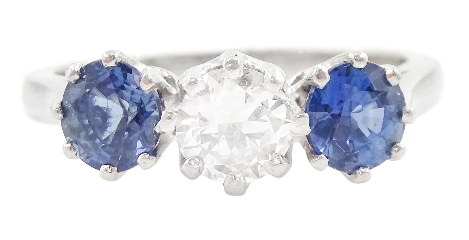 Platinum three stone round cut diamond and cornflower blue sapphire ring, Birmingham 1995, diamond approx 0.50 carat, total sapphire weight approx 1.15 carat