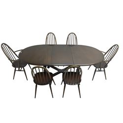 Ercol - 'Old Colonial' 705 elm extending dining table, oval top with hidden leaf, raised on turned supports united by X-stretcher (W163cm D108cm H72cm); and Ercol - set six  (4+2) dark elm 'Quaker Back Windsor Dining Chairs', hoop and stick backs 