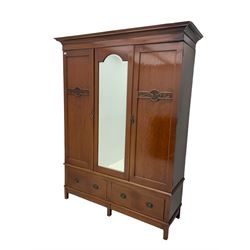 Edwardian mahogany triple wardrobe, centre mirror, two base drawers
