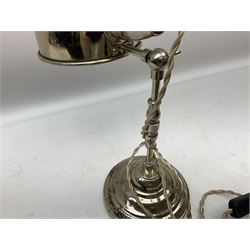 Chrome table lamp with adjustable head, on a circular plinth with relief decoration, untested, H40cm  