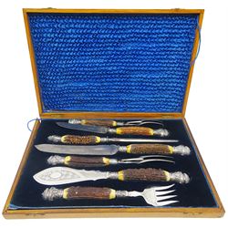 Victorian seven piece silver mounted antler handled carving set, the silver ferrules and terminals embossed with deer masks and fruit swags, hallmarked Francis Cholerton, and Mappin Brothers, Sheffield 1888, two steel blades stamoed J H Potter Cutler & Silversmith Sheffield, and one prong stamped J H Potter, contained within a fitted mahogany case with vacant brass cartouche to the hinged cover 

