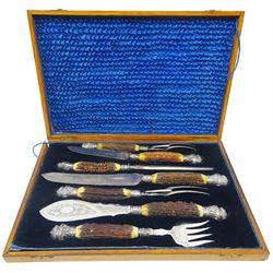 Victorian seven piece silver mounted antler handled carving set, the silver ferrules and terminals embossed with deer masks and fruit swags, hallmarked Francis Cholerton, and Mappin Brothers, Sheffield 1888, two steel blades stamoed J H Potter Cutler & Silversmith Sheffield, and one prong stamped J H Potter, contained within a fitted mahogany case with vacant brass cartouche to the hinged cover 

