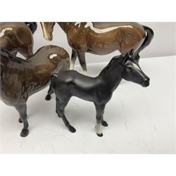 Four Beswick horses, including Exmoor no 1645, Black Beauty foal and two others 