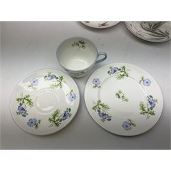 Set of six Shelley teacup trios, to include examples decorated in the Blue Poppy pattern no 14168, Bridal Rose pattern, Green Grapes & Leaves no 13616, Pastoral pink dandelion no 13893 etc, all with printed marks beneath