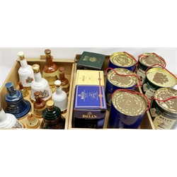 A collection of various Bell's Whisky decanters, to include three Royal Commemorative examples, a number in boxes/tins. 