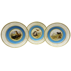  Set of three late Victorian Minton cabinet plates hand painted with Hunting Dogs in a moorland landscape after Edwin Landseer, by Henry Mitchell, on turquoise ground within a pierced gilt basket weave border, two initialled 'HyM' and two with retailer's marks, c1879, pattern no. G739, D25cm (3) Provenance Property of Bob Heath, Brandesburton Formerly of Ravenfield Hall Farm near Rotherham  