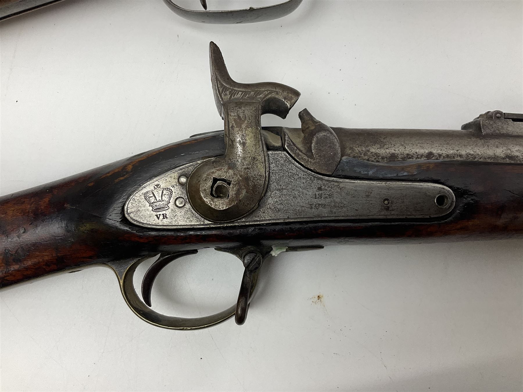 19th century Indian .577 Enfield muzzle loading rifle, proofed for 26-bore, the 98.5cm barrel with three barrel bands and later ram rod L140cm overall; 19th century Belgian side-by-side double barrel percussion shotgun, approximately 20-bore, with 74cm barrels and studded walnut stock, lock plate marked 'Liege 1868' and 'V. Gulikers-Maquinay' L117cm overall; and another side-by-side double barrel shotgun by Smythe with underlever opening (3)