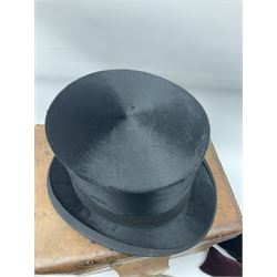 Gentlemen's black brushed silk top hat by Henry Heath of London housed in a leather case with dark red velvet interior, along with a 'Mcdonald' rotary hat iron patented 1892