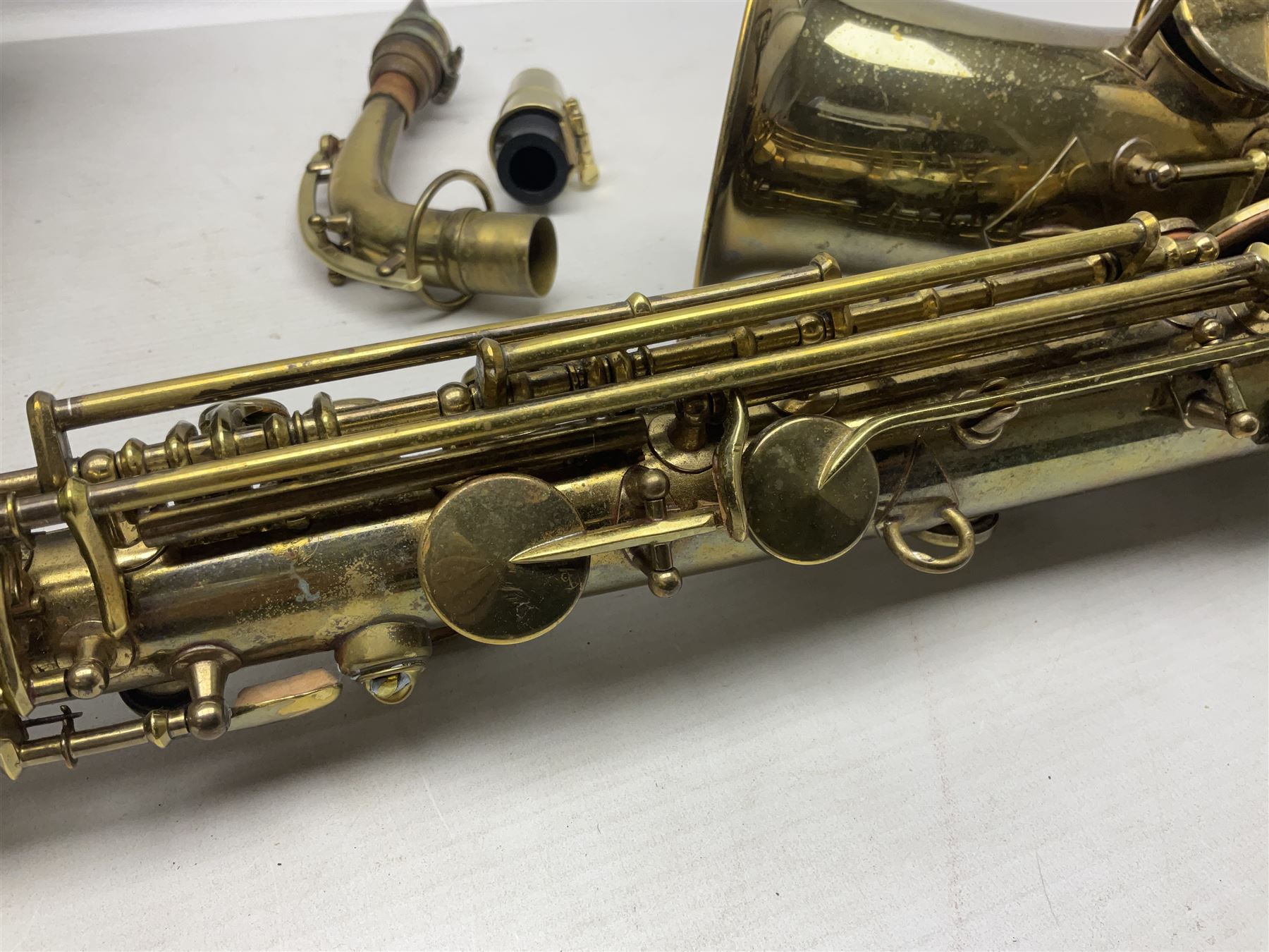 Lacquered brass 'King' alto saxophone inscribed Made by the H.N. White Co.' (Cleveland Ohio) with crook, serial no.84128; also stamped No.1 549 911 and Pat D 8-18-25; in fitted carrying case 