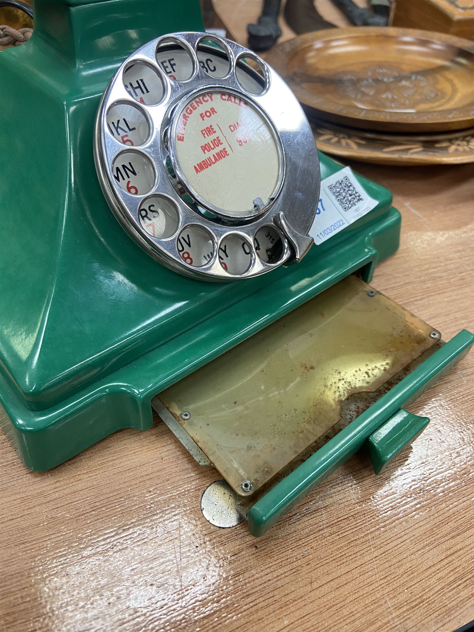 Jade green Bakelite telephone, of pyramid form with alphabet dial, brown braided handset cord and a base draw