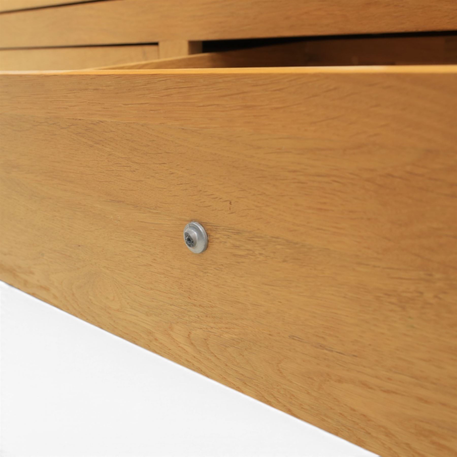 Solid oak chest of drawers, three over four drawers with metal pulls 