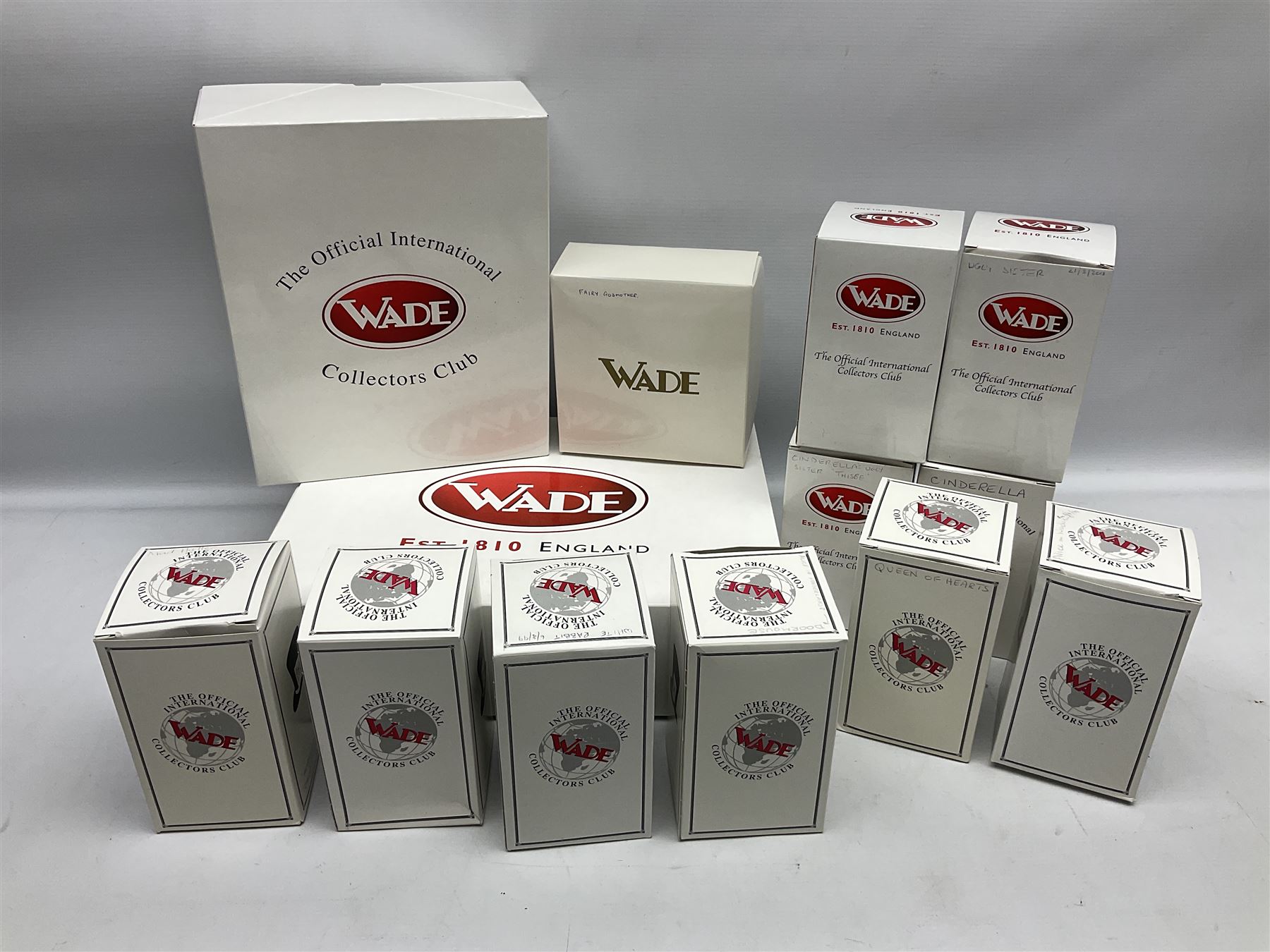 Thirteen Wade Collectors Club figures, comprising six Alice in Wonderland figures; Queen of Hearts, Alice, Mad Hatter, The Doormouse, White Rabbit and Cheshire cat, six Cinderella figures; Fairy Godmother, Cinderella Ready for the Ball, Prince Charming, Cinderella, Clorinda and Thisbe, together with Beauty from Beauty and the Beast, all with original boxes  