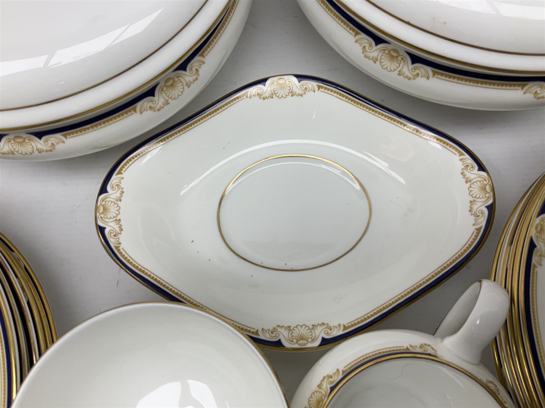 Wedgwood Cavendish pattern dinner service for twelve, comprising dinner plates, side plates, bowls, soup bowls, two tureens, saucer boat and sauce, together with matching part coffee service (82) 