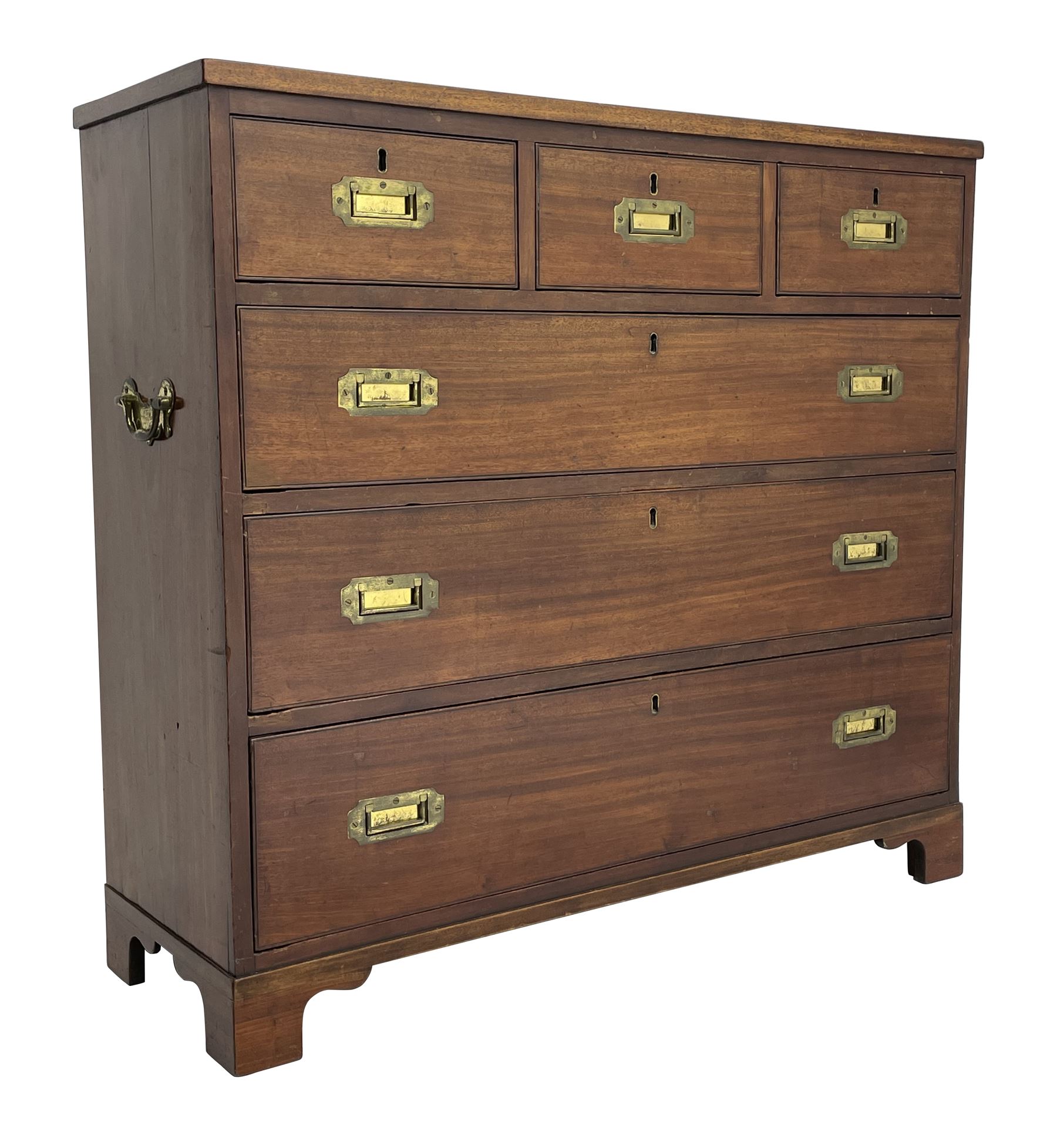 Georgian military type campaign chest, narrow rectangular top over three short and three long drawers, recessed brass handles, on bracket feet