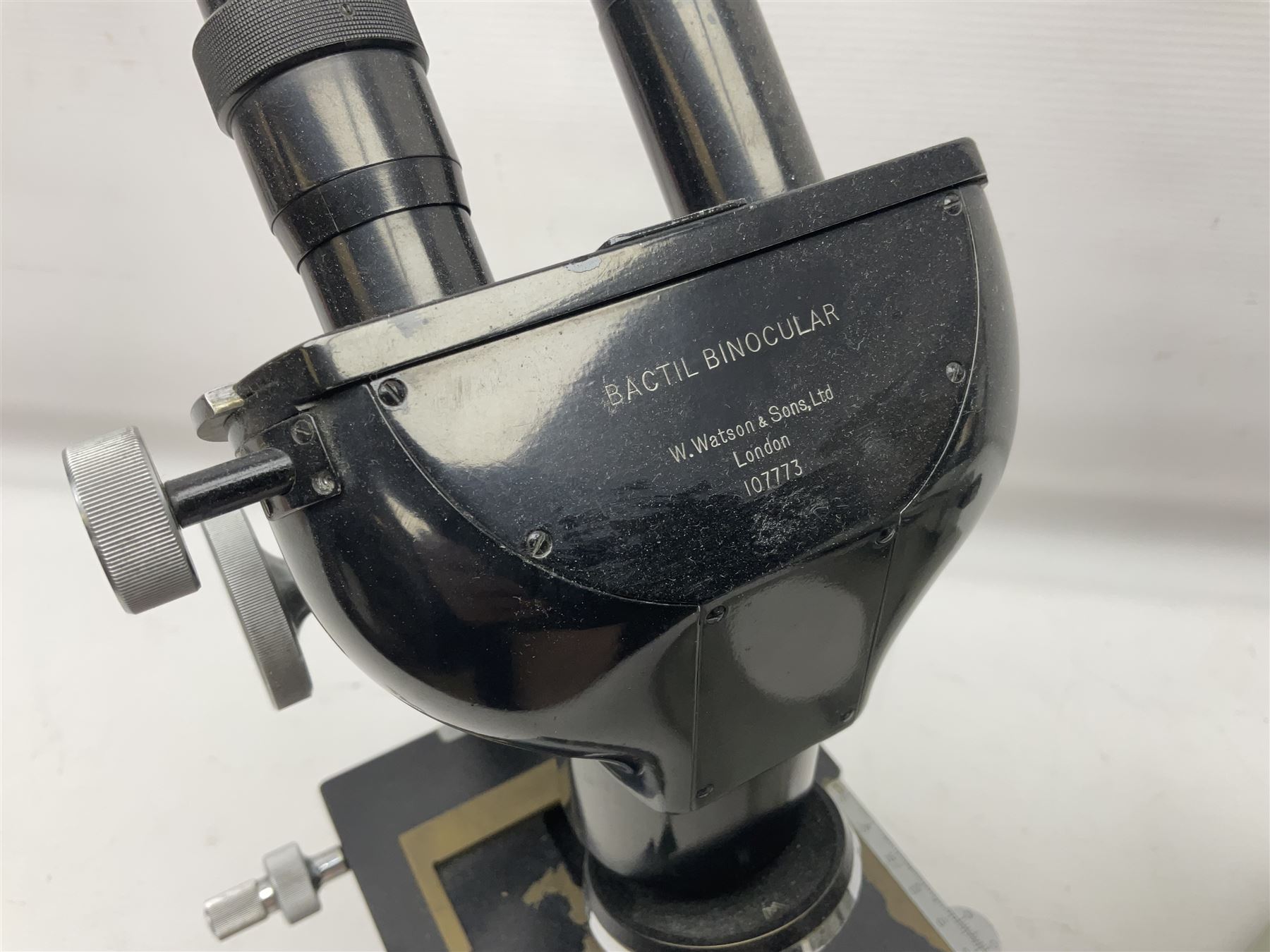 Three Binocular microscopes, comprising two W. Watson & Sons Bactil no 110331 and 107773 and Tasco LMSQF-F