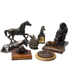 Two commemorative bronze medallions, each depicting horses, the first with 'Salon du Cheva...