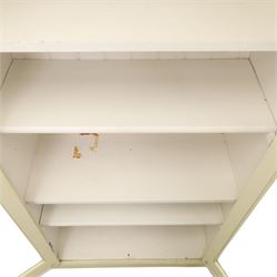 Traditional white painted pine display cabinet, projecting cornice above two glazed doors enclosing five fixed shelves, tongue and groove back raised on a plinth base