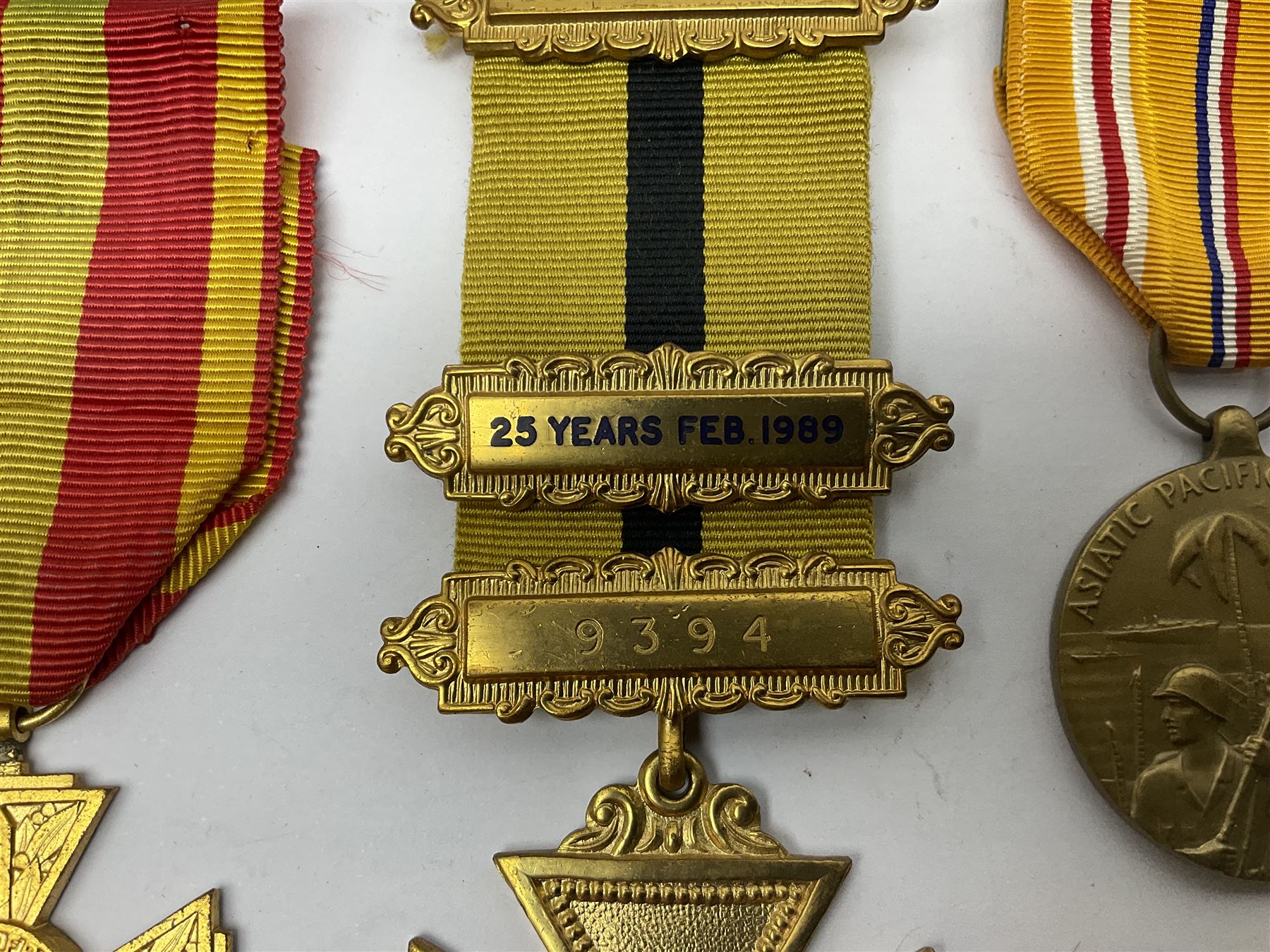 RAOB jewel Bourn Lodge 9394 with 25 years bar; two masonic jewels and triangular pendant watch; British Iron Cross style propaganda medallion; French Legion of Honour and Combatants Cross; and three foreign medals