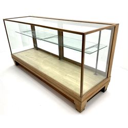 Mid century oak framed glazed display counter, two sliding doors, glazed shelves W182cm, H91cm, D61cm