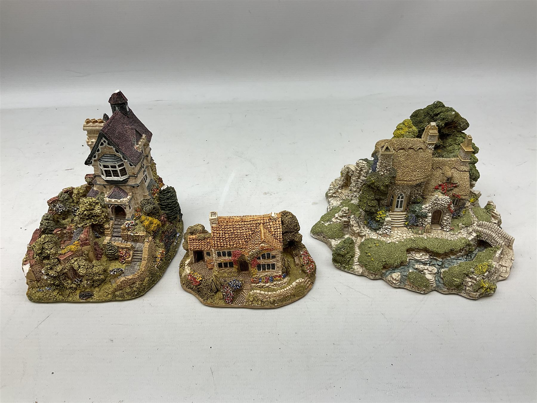 Forty six Lilliput Lane model cottages, to include 'Convent in the Woods', 'Holme Dyke' 'Secret Garden' etc