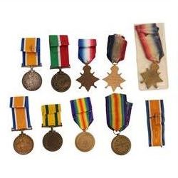 WWI British group of nine medals and silver war badge, including bronze War medal, 1914 Star, South African Victory medal, Mercantile Marine medal, Territorial Force war medal