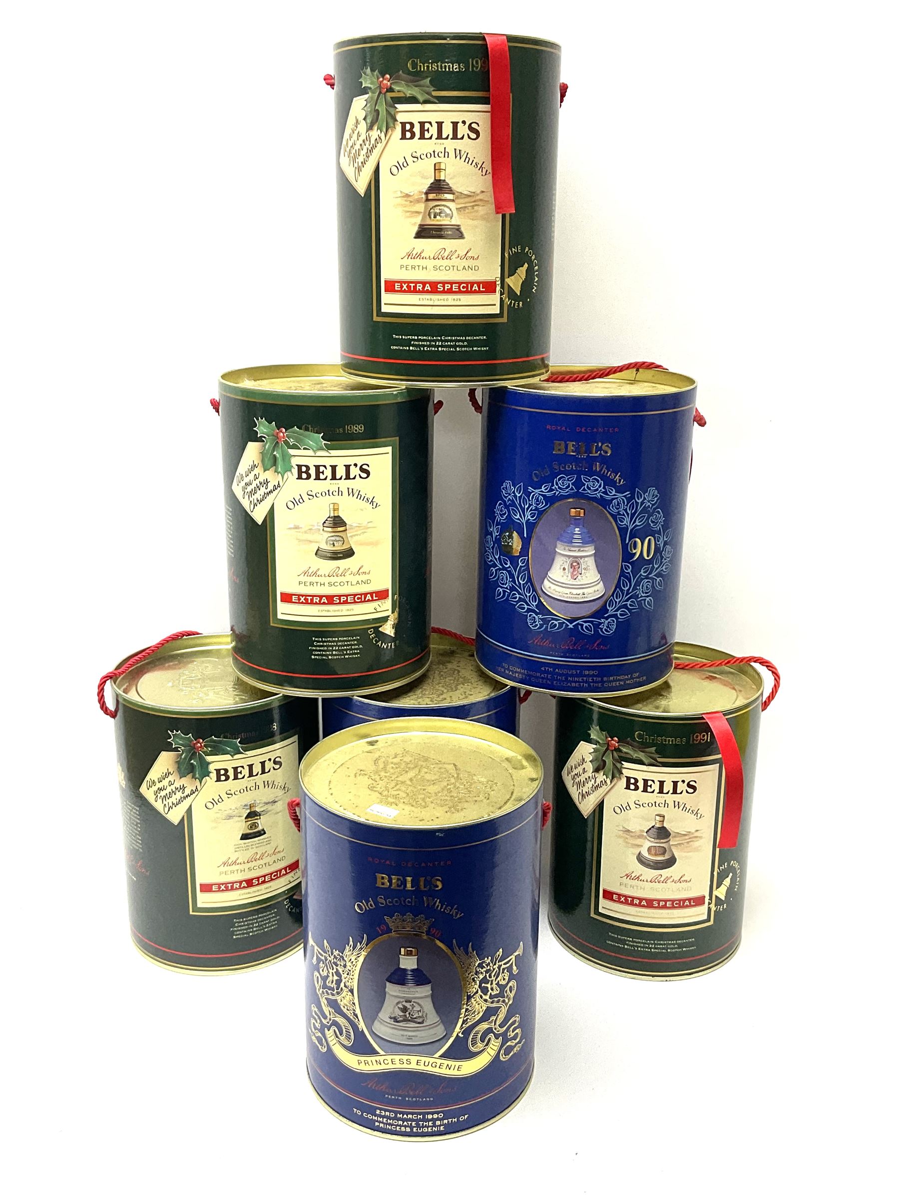 Seven Bell's Old Scotch Whisky ceramic decanters comprising Christmas 1988, 1989, 1990 and 1991 and three Royal Decanters 'Pricess Beatrice 1988', 'Princess Eugenie 1990' and 'The Queen Mother 1990', each 75cl, 43%vol, all decanter seals intact, each housed in a round box (7)