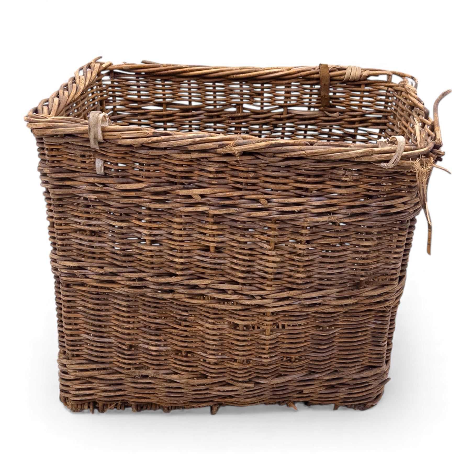 Large 20th century wicker laundry basket, of rectangular form, with stencilled lettering to one sides, raised on wooden base skids