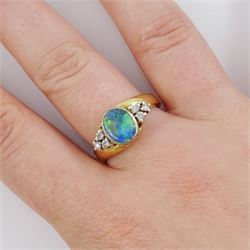 18ct gold opal and diamond ring, single oval cut opal, with three round brilliant cut diamonds set either side, stamped 750, total diamond weight approx 0.20 carat