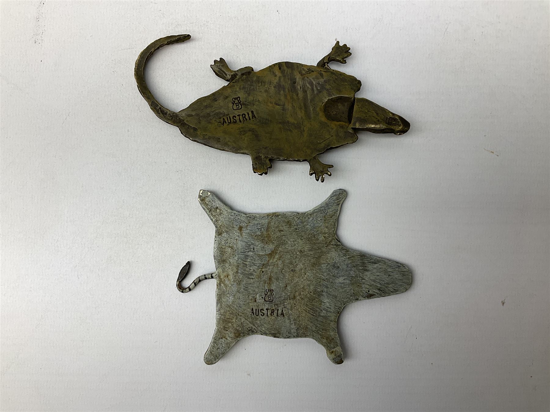 After Franz Xavier Bergman, two cold painted bronzes modelled as a crocodile skin, and a zebra skin, each stamped beneath with B within an amphora and Austria, crocodile L12.5cm, zebra 10.5cm