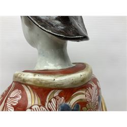 Large Japanese Imari porcelain figure, modelled as a Bijin, wearing a long kimono decorated with apple blossom and leafy branches on a white ground, with gilt detailing, possibly Edo period, H63cm