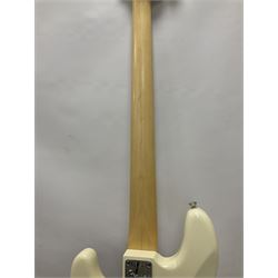 Fender Precision Bass guitar, in Olympic White finish with tortoiseshell effect scratchboard, serial no US15103092, in black Fender hard case with Fender strap and warranty card, guitar L116cm