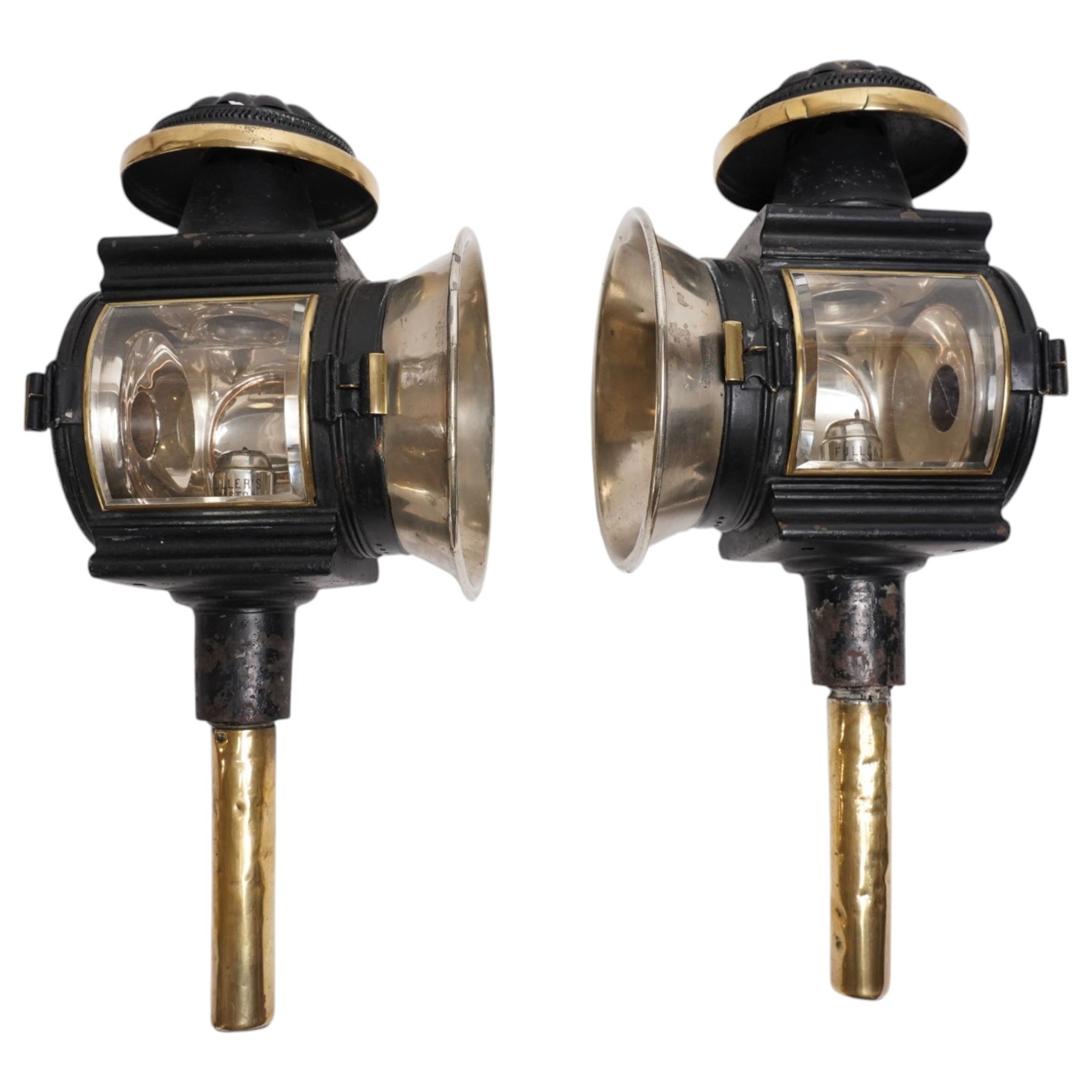 Fuller’s (Bristol) - pair of large Edwardian brass and toleware carriage lamps, the chimney of lobed decoration over a cylindrical body with large circular convex lens with bevelled plate and rear circular red reverse light, on brass cylindrical stem