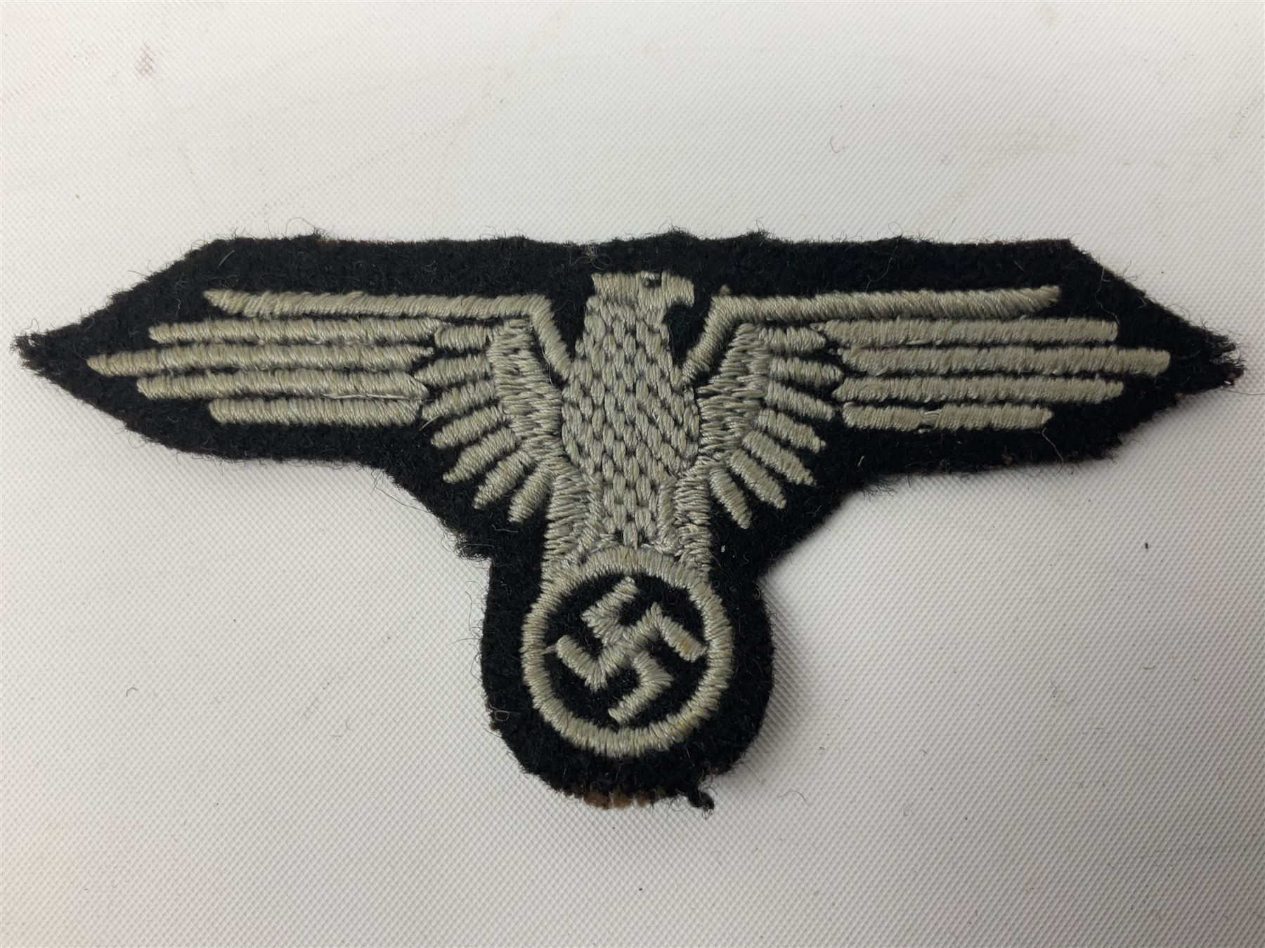 Two WW2 German 'SS' uniform cloth collar patches and sleeve eagle for Schafuhrer rank (3)
