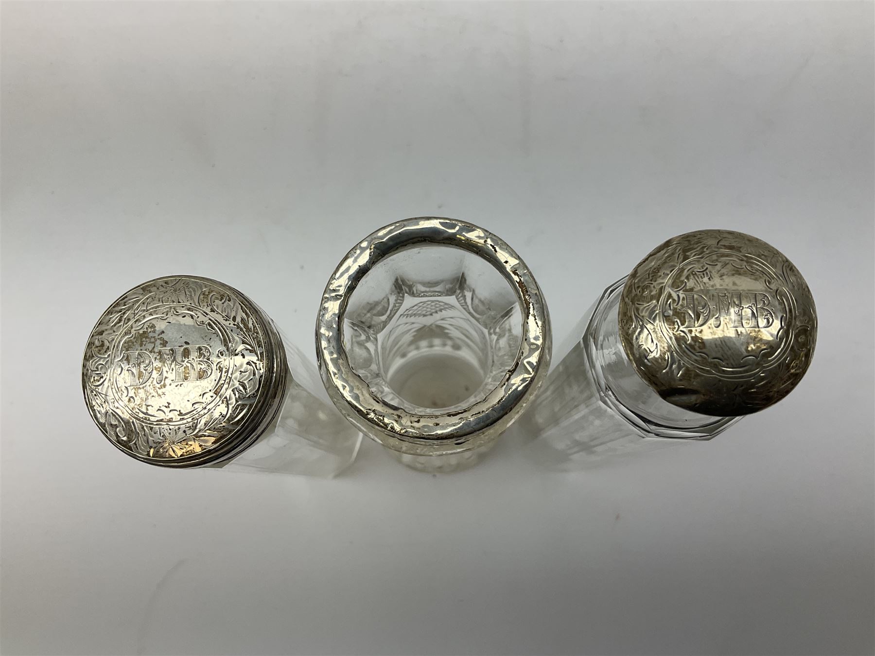 1920's silver stand, hallmarked Birmingham 1922, together with two tall faceted clear glass dressing table jars with hallmarked silver covers, and cut glass vase with hallmarked silver mounted collar, and small group of silver handled accessories, including files, picks, etc., approximate total silver weight 58.8 grams