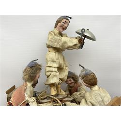 Mid 20th century Brinquinho folk art instrument from Madeira, Portugal, with wood dolls dressed in traditional costume with castanets and bottle caps, L94cm, together with a green, black and white festival mask